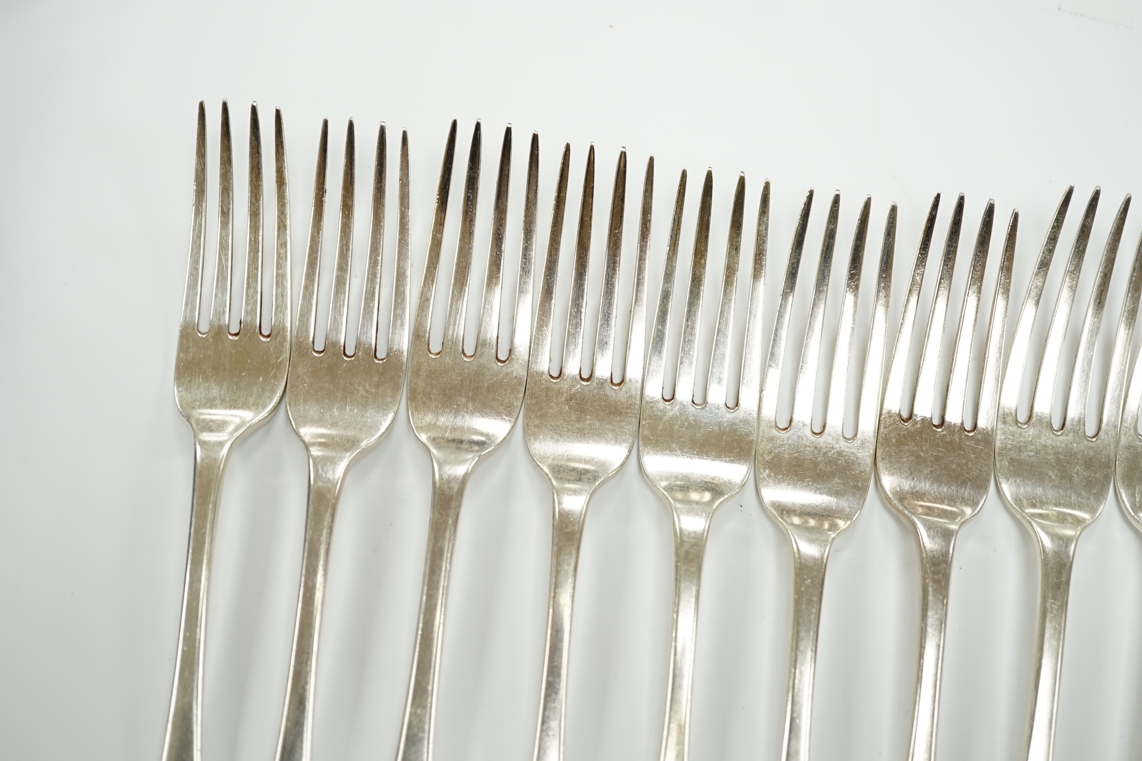 A set of six George IV silver table forks, London, 1824 and a later similar Victorian set, London, 1837, 25.8oz.